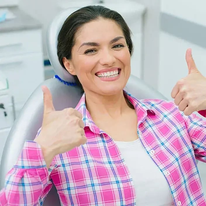 middle-age-woman-with-two-thumbs-up-705x705